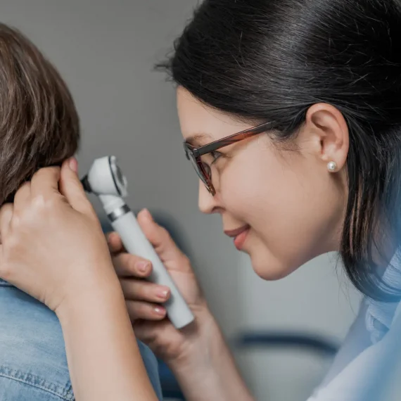 close-up-of-doctor-examining-boy-s-ear-with-otosco-2025-01-09-03-43-10-utc