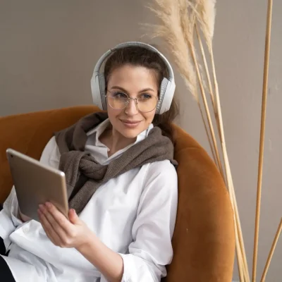 woman-listening-to-music-with-headphones-2023-11-27-05-12-09-utc